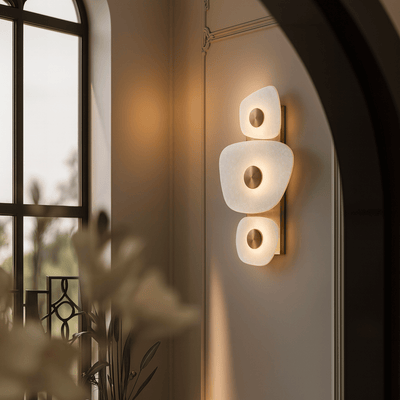Natural marble brass wall sconce with up-down lighting for creating visual height in low ceiling rooms