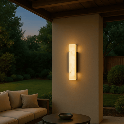 Uteld Outdoor LED Wall Light with Marble Effect mounted on home facade showing brushed stainless steel housing and marble effect diffuser
